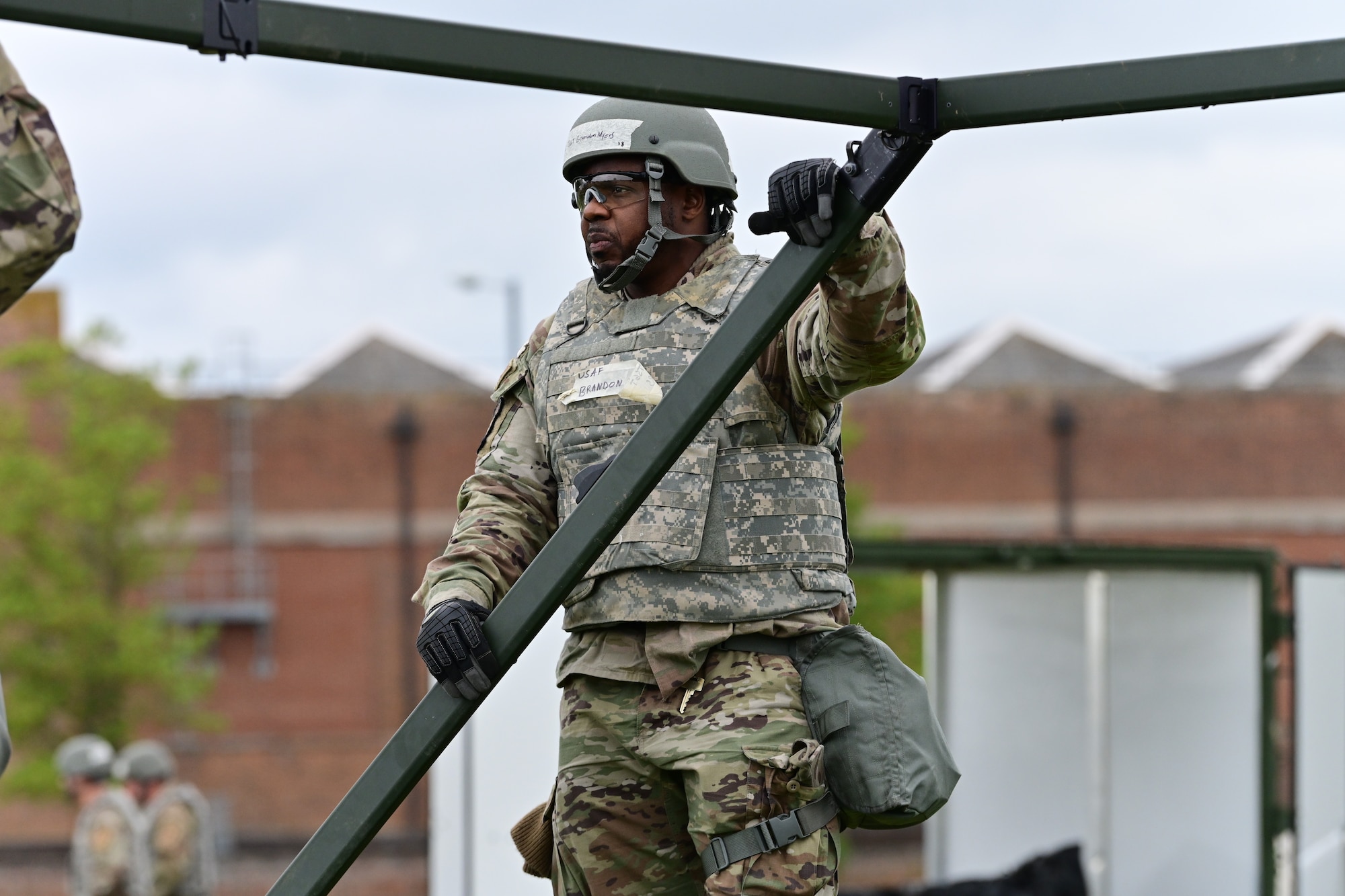 U.S. Air Force Tech. Sgt. Brandon Myers, 100th Civil Engineering Squadron, Heating, ventilation and air conditioning non commissioned officer in charge, puts up a section of a temporary tent during a simulated deployment as part of combat readiness inspection Skyway Chariot at RAF Feltwell, England, May 8, 2025.