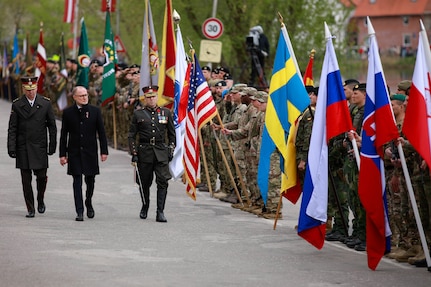 Commander of the Latvian National Armed Forces Maj. Gen. Kaspars Pudāns (left), Latvian Minister of Defense, Andris Sprūds (center), and Latvian National Armed Forces Col. Edmunds Svenčs, commander of the National Guard 4th Brigade, inspect a formation of multinational soldiers before the parade celebrating the Day of Restoration of Latvian Independence held in Talsi, Latvia, May 4, 2025. The Day of the Restoration of Latvian Independence is also observed as a freedom celebration, and a military parade has been held every year since 2012. U.S. presence in Latvia enhances combat readiness, ensuring U.S. forces can operate effectively alongside Latvian and NATO allies in diverse conditions. (U.S. Army photo by Sgt. Trevor Wilson)