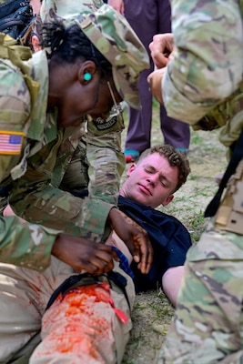 250404-N-BC658-1871 FORT BRAGG, NC (Apr. 04, 2025) Soldiers attending CAPEX2025 assist special operations medical personnel comprised of Soldiers and Sailors during a mass casualty event demonstration during the exercise on Fort Bragg, North Carolina, April 4, 2025. CAPEX2025, hosted by U.S. Army Special Operations Command, allows participants to experience and better understand the capabilities and unique mission sets that Army Special Operations forces plan, prepare, and train to execute successfully around the world. U.S. Army John F. Kennedy Special Warfare Center and School's; Joint Special Operations Medical Training Center (JSOMTC) and the provide world-class medical and skills training to special operations medical personnel of the Army, Navy and Marine Corps. (U.S. Navy photo by Mass Communication Specialist 1st Class Russell Lindsey SW/AW)