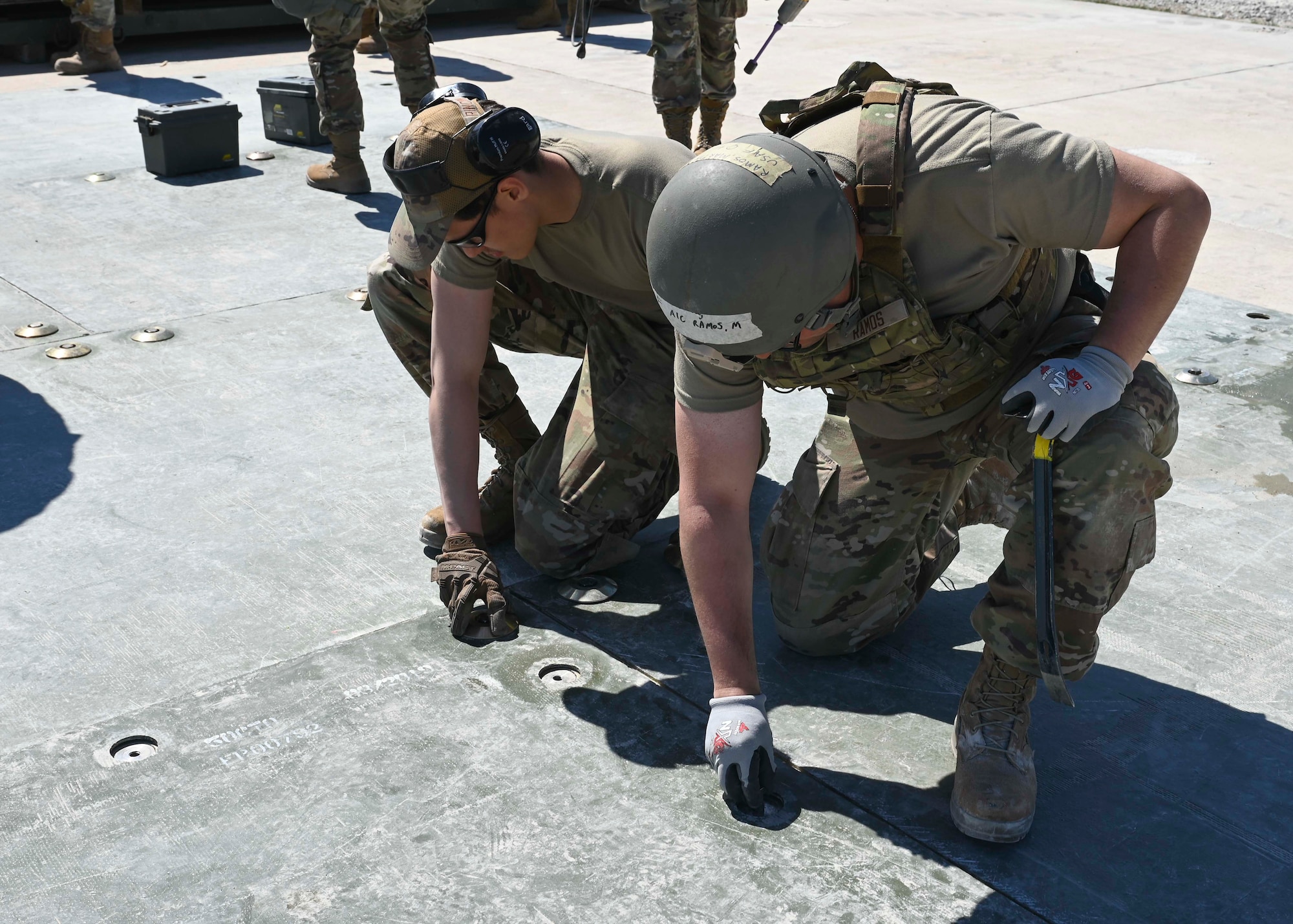 U.S. Airmen assigned to the 100th Civil Engineer Squadron build an emergency flight line during combat readiness inspection Skyway Chariot at RAF Feltwell, England, May 9, 2025.