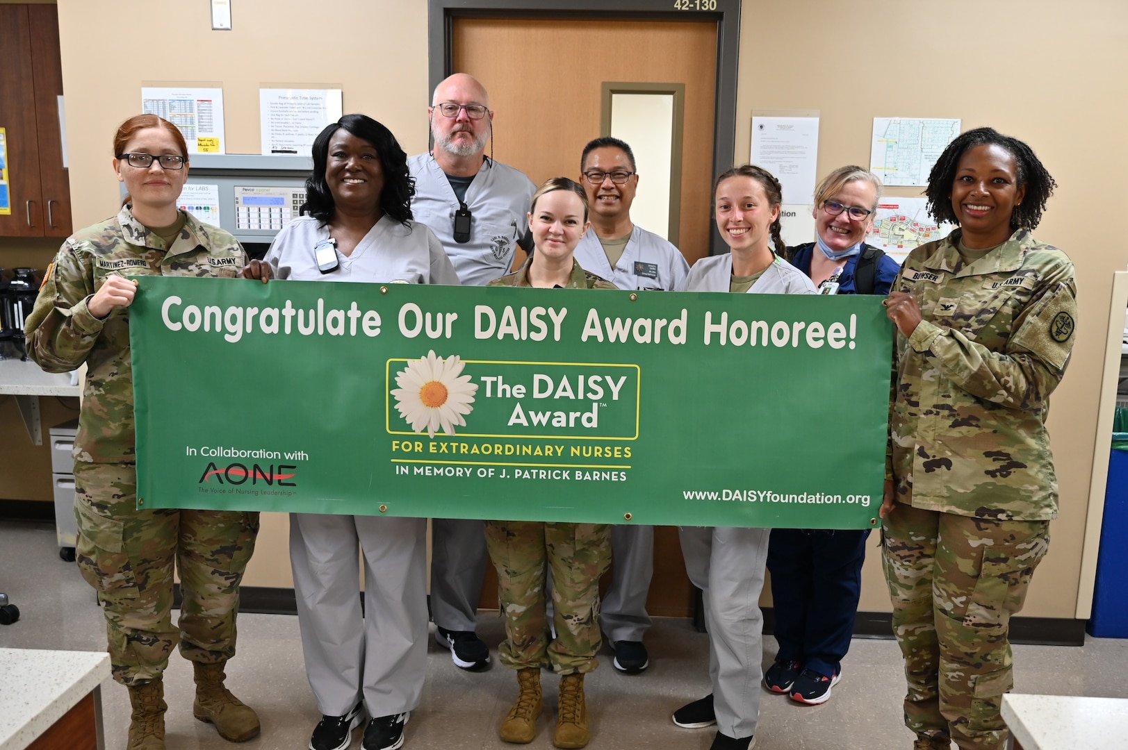 Group photo of Jeanne Mitchell receiving DAISY Award