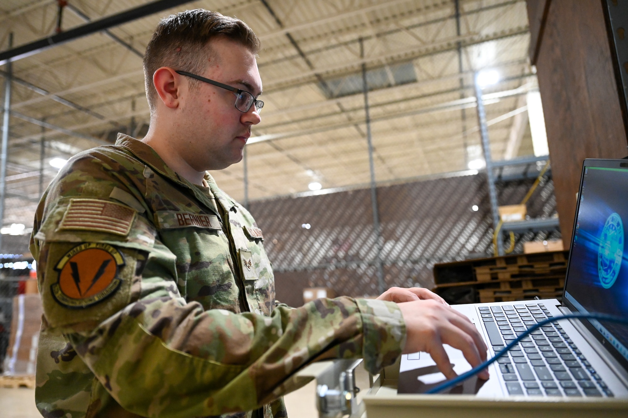 U.S. Airman types on a computer