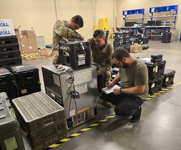 Radames Feliciano, right, a biomedical equipment technician with the U.S. Army Medical Materiel Agency, works with medics from 2nd Brigade, 82nd Airborne Division, to inventory medical equipment at the new Home-Station Medical Maintenance Support shop at Fort Liberty, North Carolina.