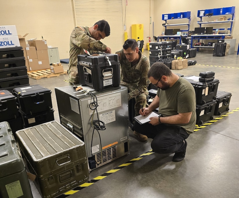 Radames Feliciano, right, a biomedical equipment technician with the U.S. Army Medical Materiel Agency, works with medics from 2nd Brigade, 82nd Airborne Division, to inventory medical equipment at the new Home-Station Medical Maintenance Support shop at Fort Liberty, North Carolina.