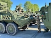 A couple of chemical, biological, radiological, and nuclear (CBRN) defense specialists from the 48th Chemical Brigade’s 59th Chemical Company conduct preventative maintenance checks and services on an M1135 Stryker NBC reconnaissance vehicle at the Eygelshoven Army Prepositioned Stocks-2 worksite May 12.