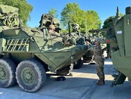 A couple of chemical, biological, radiological, and nuclear (CBRN) defense specialists from the 48th Chemical Brigade’s 59th Chemical Company conduct preventative maintenance checks and services on an M1135 Stryker NBC reconnaissance vehicle at the Eygelshoven Army Prepositioned Stocks-2 worksite May 12.