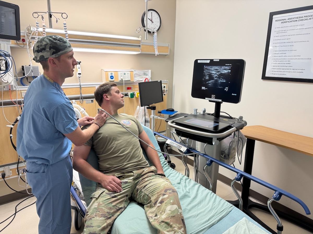 Image of two Airmen working together.