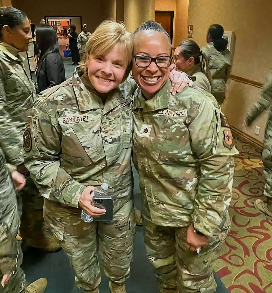 Image of two Airmen posing for a photo.