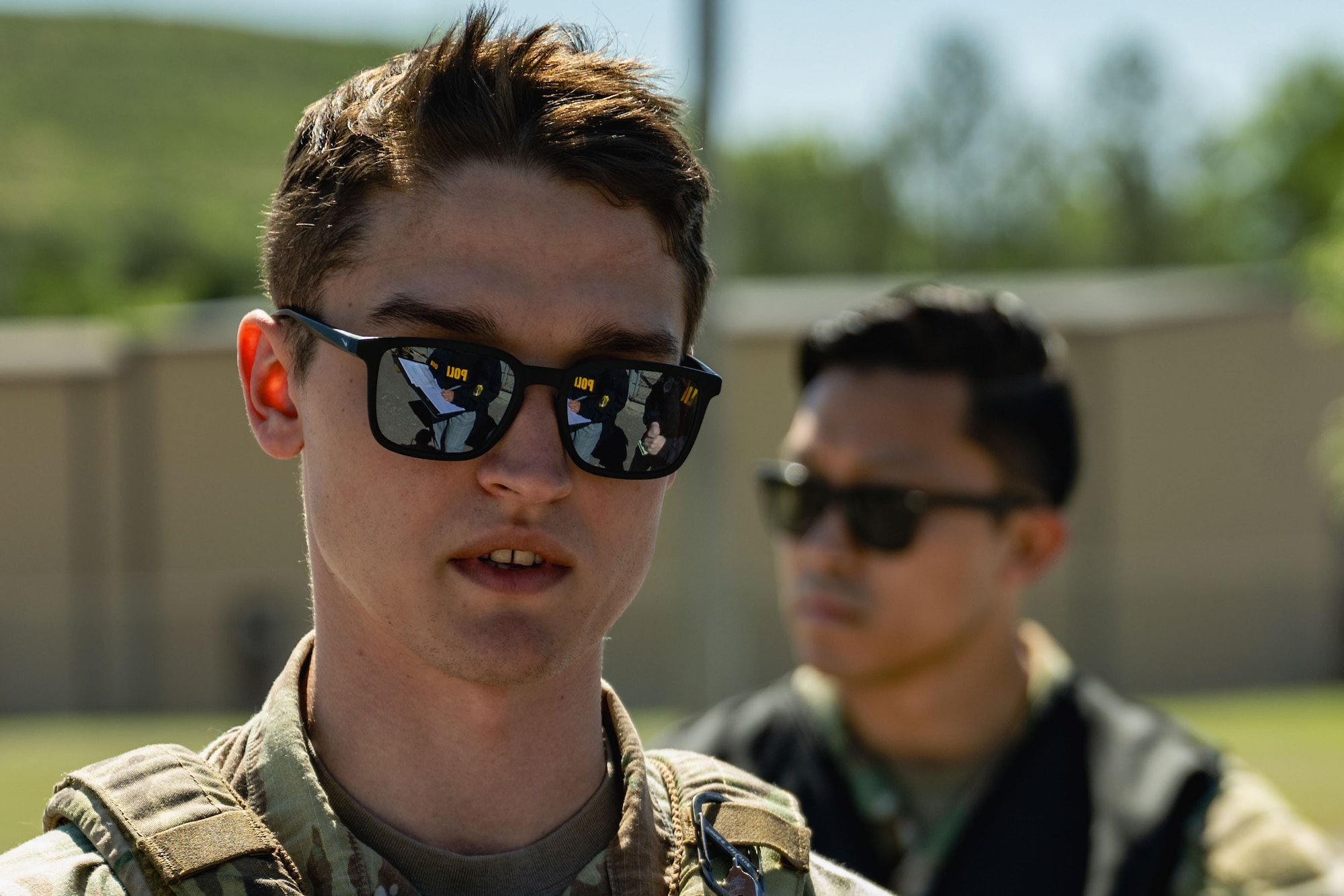 Airman speaks with an OSI agent.