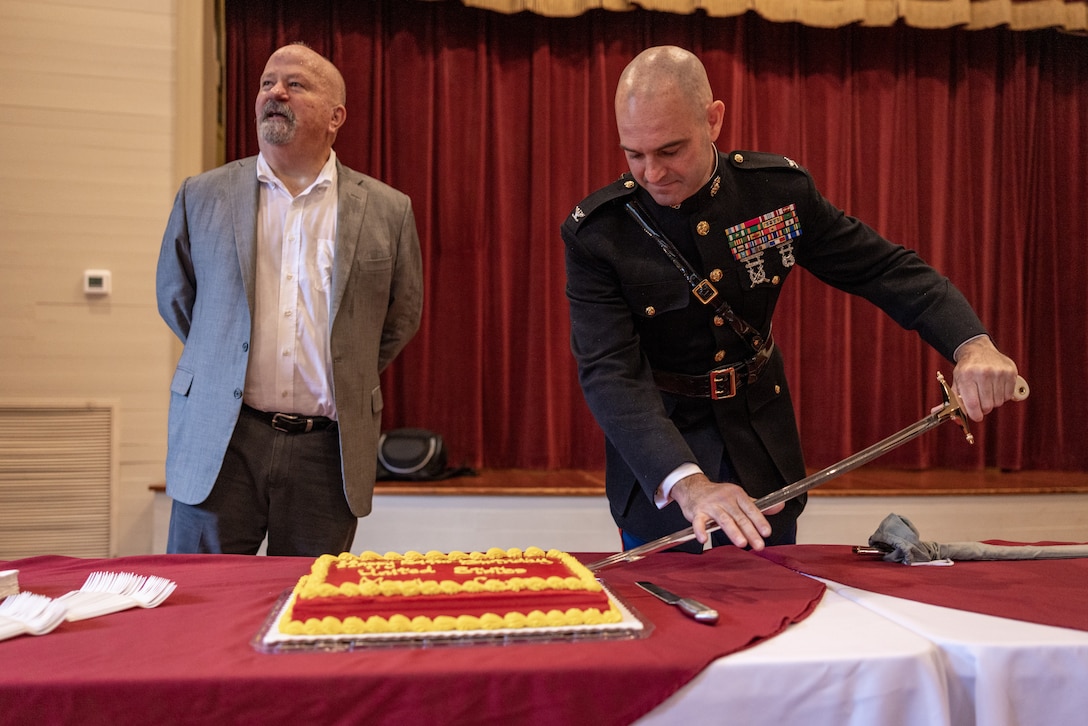 U.S. Marine Corps Col. Joseph Katz, chief of staff, Marine Forces Reserve, right, and retired Lt. Col. Robert H. Barrow, cut a cake for the Marine Corps Birthday after of a wreath laying ceremony for Barrow’s father Gen. Robert Barrow, the 27th Commandant of the Marine Corps in St. Francisville, L.A., Nov. 10, 2024.  Barrow was the first Marine Corps commandant to be buried at his hometown and not in Arlington National Cemetery. Each year on the Marine Corps Birthday, Marines with Marine Forces Reserve lay a wreath on his grave. (U.S. Marine Corps photo by Sgt. Scott Jenkins)