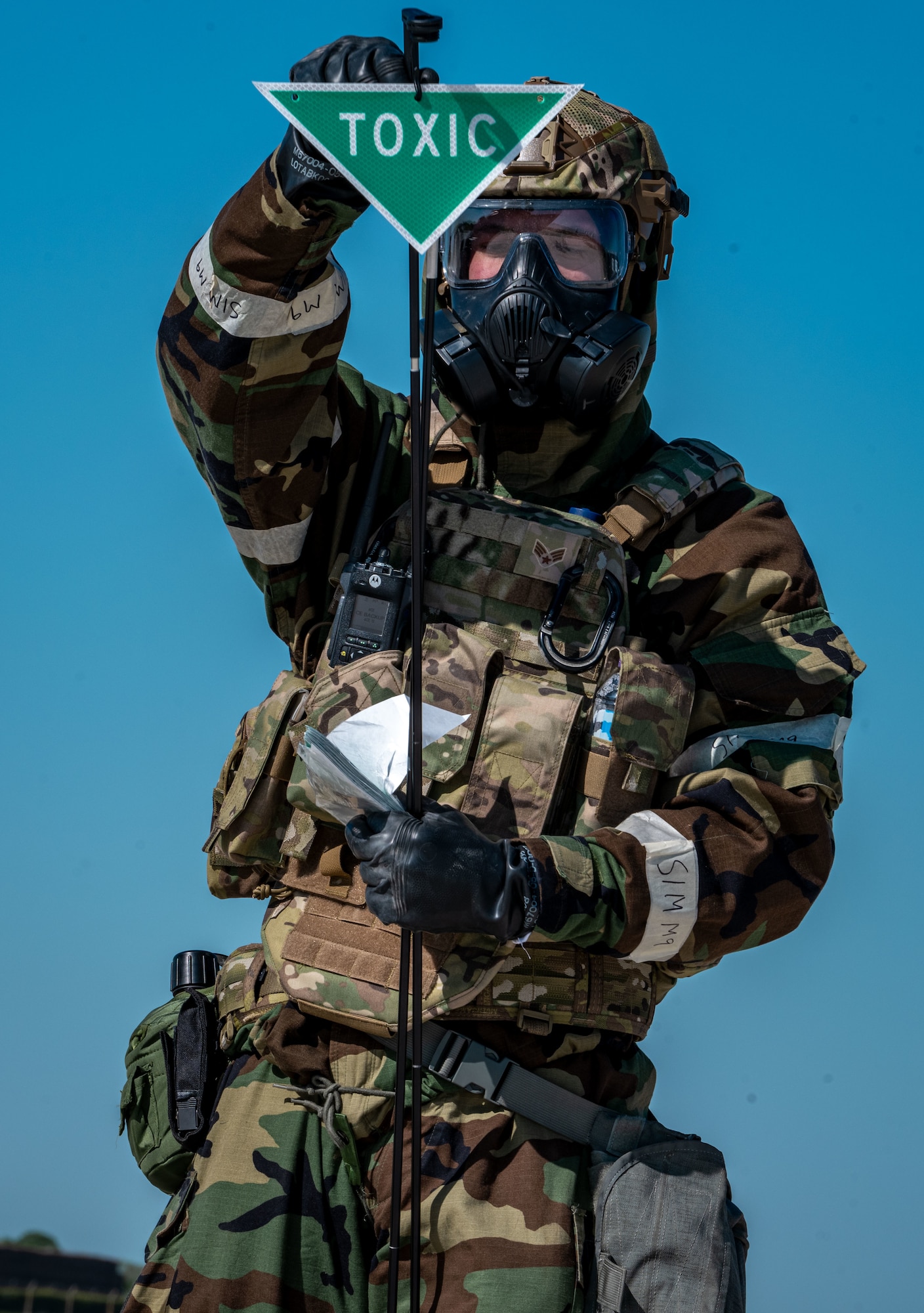 A U.S. Airman assigned to the 100th Civil Engineer Squadron sets up a marker to warn others of simulated hazardous materials during combat readiness inspection Skyway Chariot at RAF Feltwell, England, May 10, 2025.