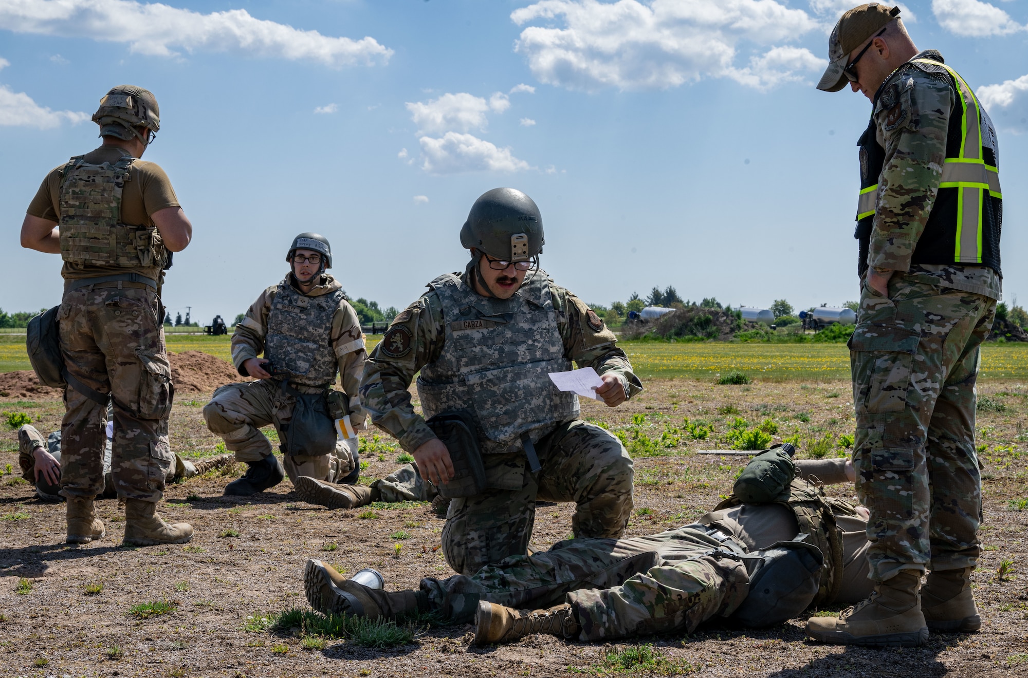 U.S. Airmen assigned to the 100th Air Refueling Wing simulate providing tactical combat casualty care during combat readiness inspection Skyway Chariot at RAF Feltwell, England, May 10, 2025.