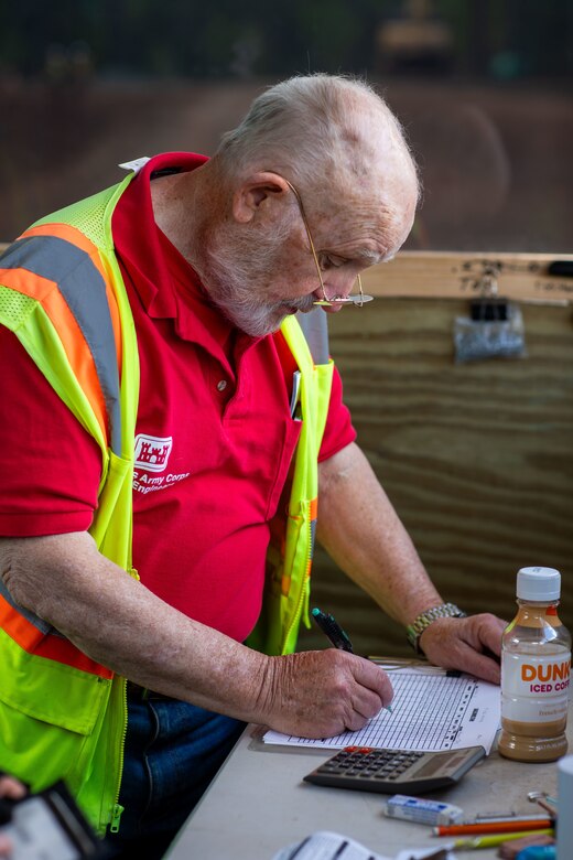 Quality Assurance Inspector Alex Watt overlooking debris removal efforts at Lake Lure TDSR. (U.S. Army photo by Makenzie Leonard)