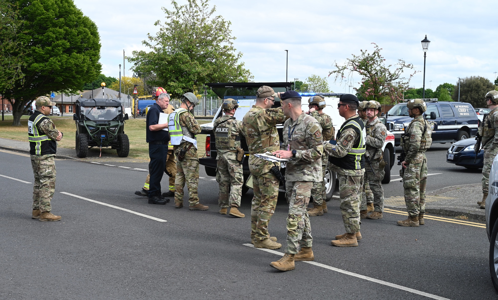 U.S. Airmen from the 100th Security Forces Squadron respond to a simulated vehicle-borne improvised explosive device scene as 100th Air Refueling Wing and U.S. Air Forces in Europe Inspector General inspection team members oversee the emergency response during the combat readiness inspection Skyway Chariot at RAF Mildenhall, England, May 8, 2025.