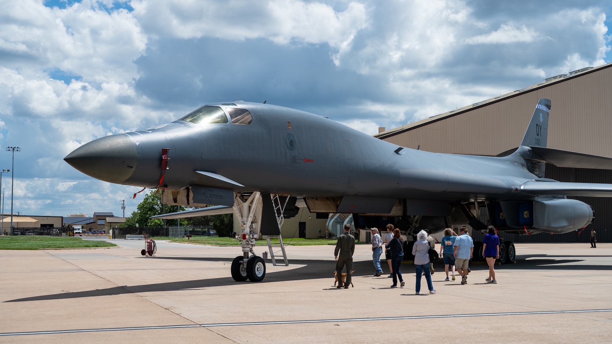 Relatives of Lt. Col. William E. Dyess observe a B-1B Lancer during a tour at Dyess Air Force Base, Texas, May 9, 2025.  The relatives toured the base while traveling through Abilene, Texas. (U.S. Air Force photo by Airman 1st Class Jade M. Caldwell)