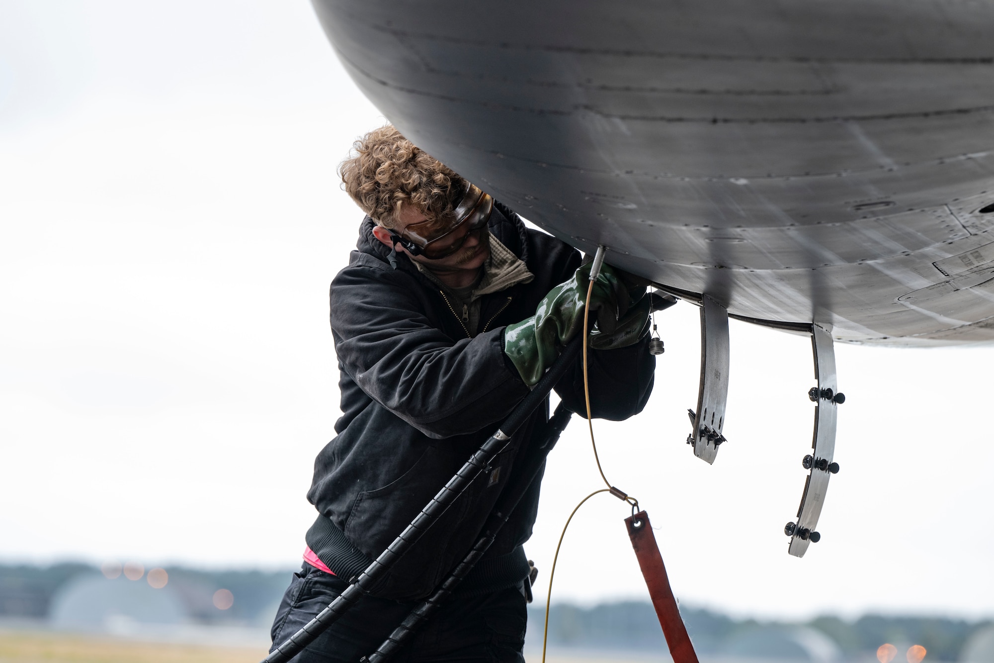 A B-1 bomber sits on the flightline in the rain