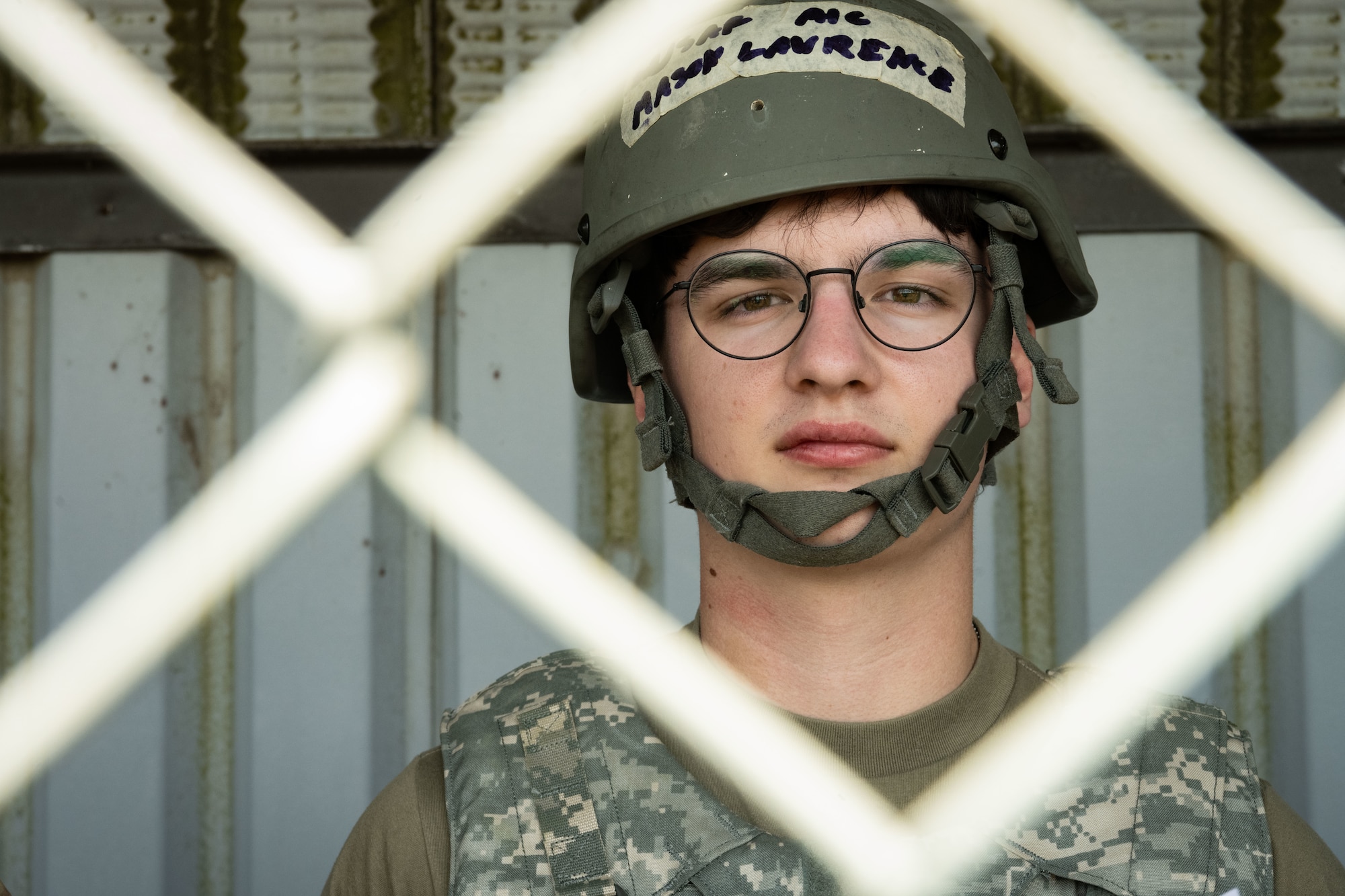 U.S. Air Force Airman 1st Class Mason Lawrence, 100th Civil Engineer Squadron heating, ventilation, and air conditioning apprentice, shows identification to inspectors in a simulated ground attack during combat readiness inspection Skyway Chariot at RAF Feltwell, May 10, 2025.