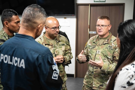 Master Sgt. Chris Wertz, Missouri National Guard State Partnership Program NCO, speaks to members of the Panamanian National Police as 2nd Lt. Minor Perez, a MONG chaplain candidate, translates in Panama City, Panama, May 8, 2025.