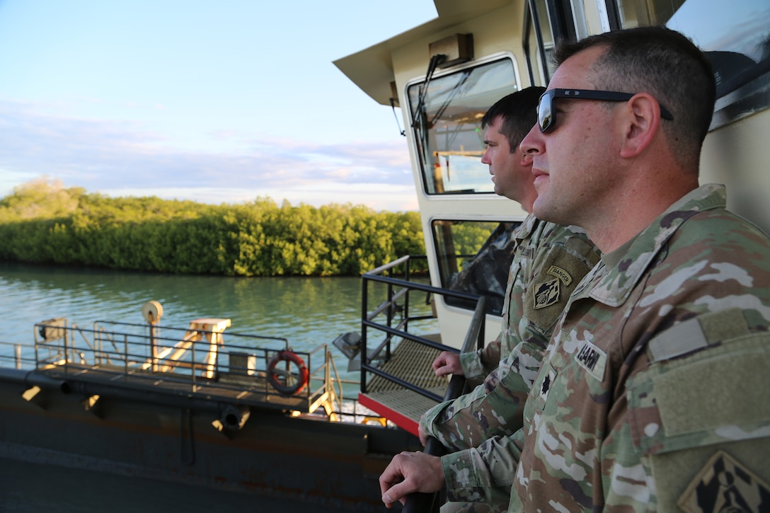 (Left) U..S. Army Maj. Matthew Westcott, U.S. Army Corps of Engineers, Deputy District Commander of the Jacksonville District and (right) U.S. Army Lt. Col. Kenneth M. Porter, U.S. Army Corps of Engineers, Deputy District Commander of the Wilmington District. observe dredging operations onboard the U.S. Army Corps of Engineers, (USACE), Dredge MURDEN in Naval Station Guantanamo Bay, Cuba, April. 23, 2025.  (USACE Photo by Mark Rankin)