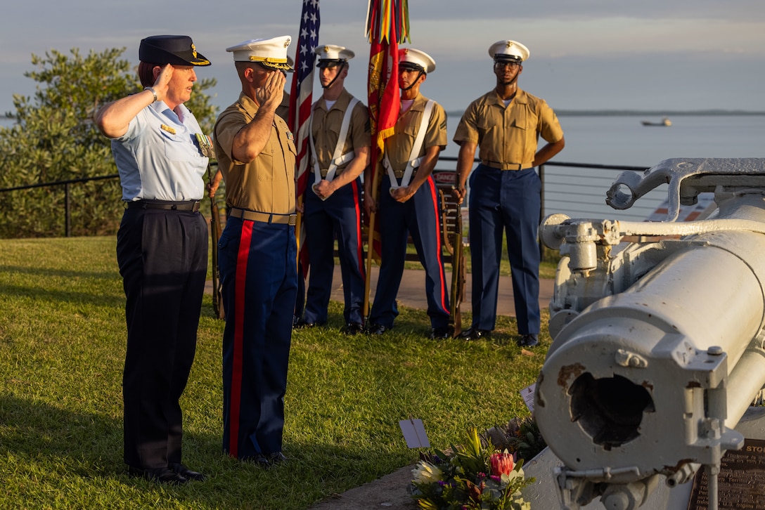 U.S. Marine Corps Lt. Col. Andrew Williamson, right, the executive officer of Marine Rotational Force – Darwin 25.3, salutes with Group Captain Melissa Neilson, the commander of Headquarters Northern Command, during the 83rd anniversary ceremony of the Battle of the Coral Sea in Darwin, Australia, May 6, 2025.