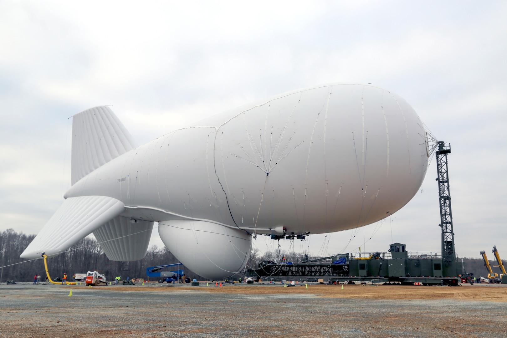 Joint Land Attack Cruise Missile Defense Elevated Netted Sensor System (JLENS) personnel oversee the inflation of an aerostat
