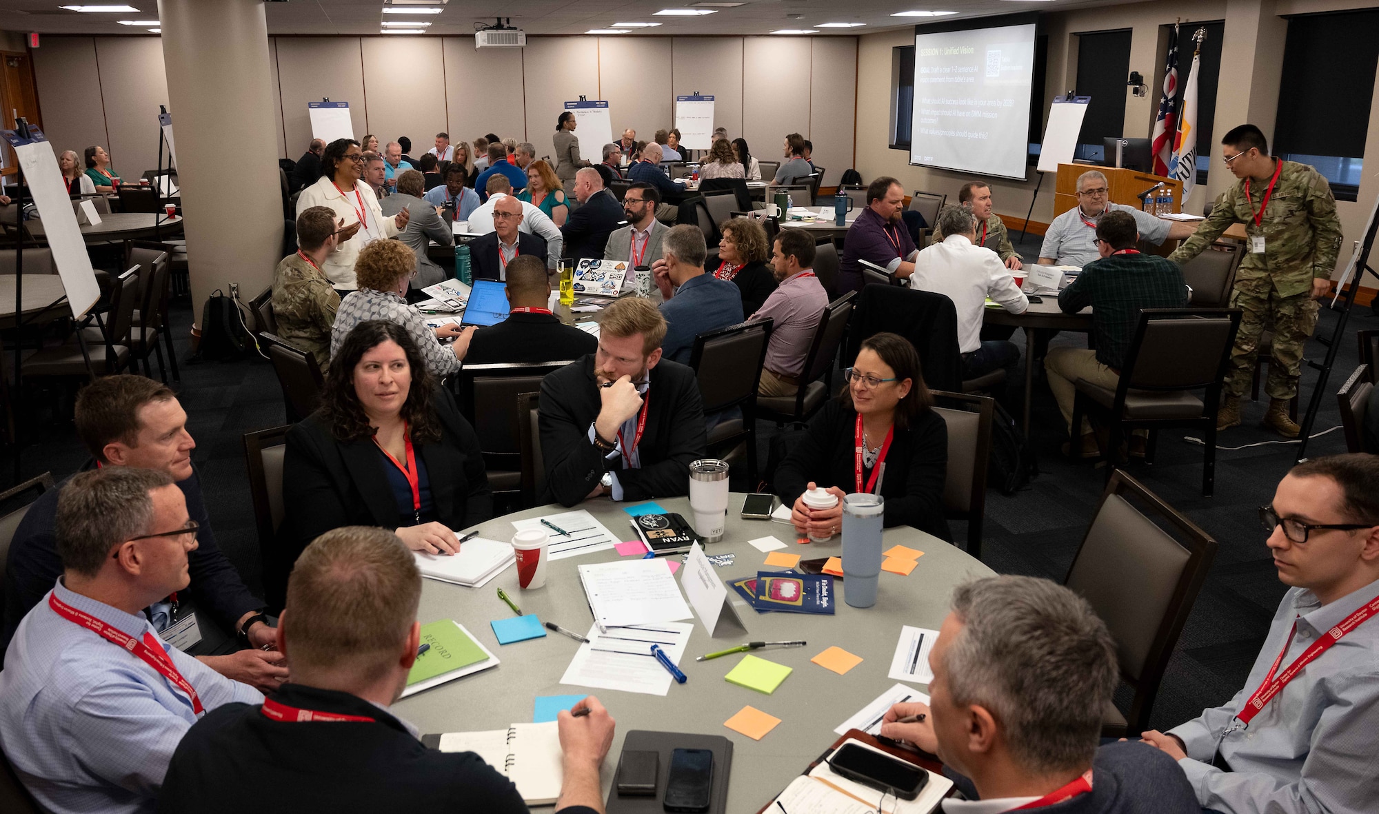 Airmen and civilians brainstorm.