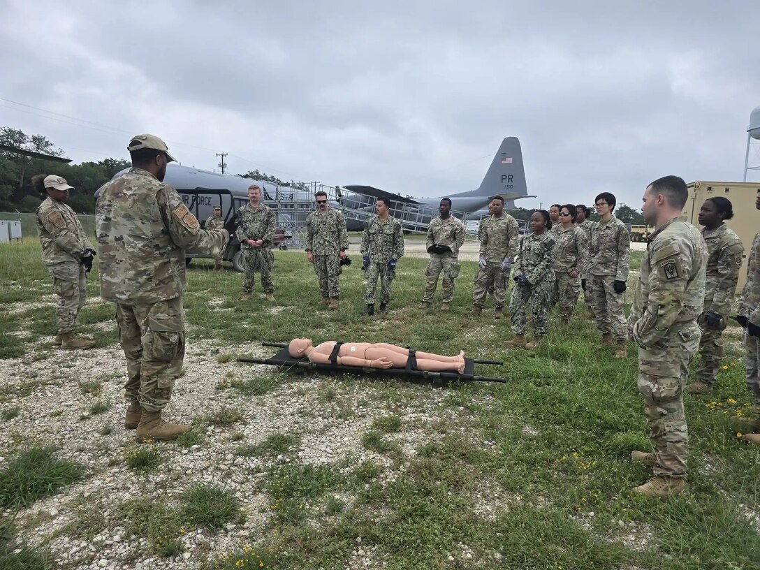 Army and Navy students in the Medical Education and Training Campus Respiratory Therapist course conduct a Joint Field Training Exercise on Joint Base San Antonio-Camp Bullis, Texas. A crucial component of the exercise involves Medical Evacuation and Aeromedical Evacuation procedures. Students learn the proper techniques for packaging and loading patients for transport.