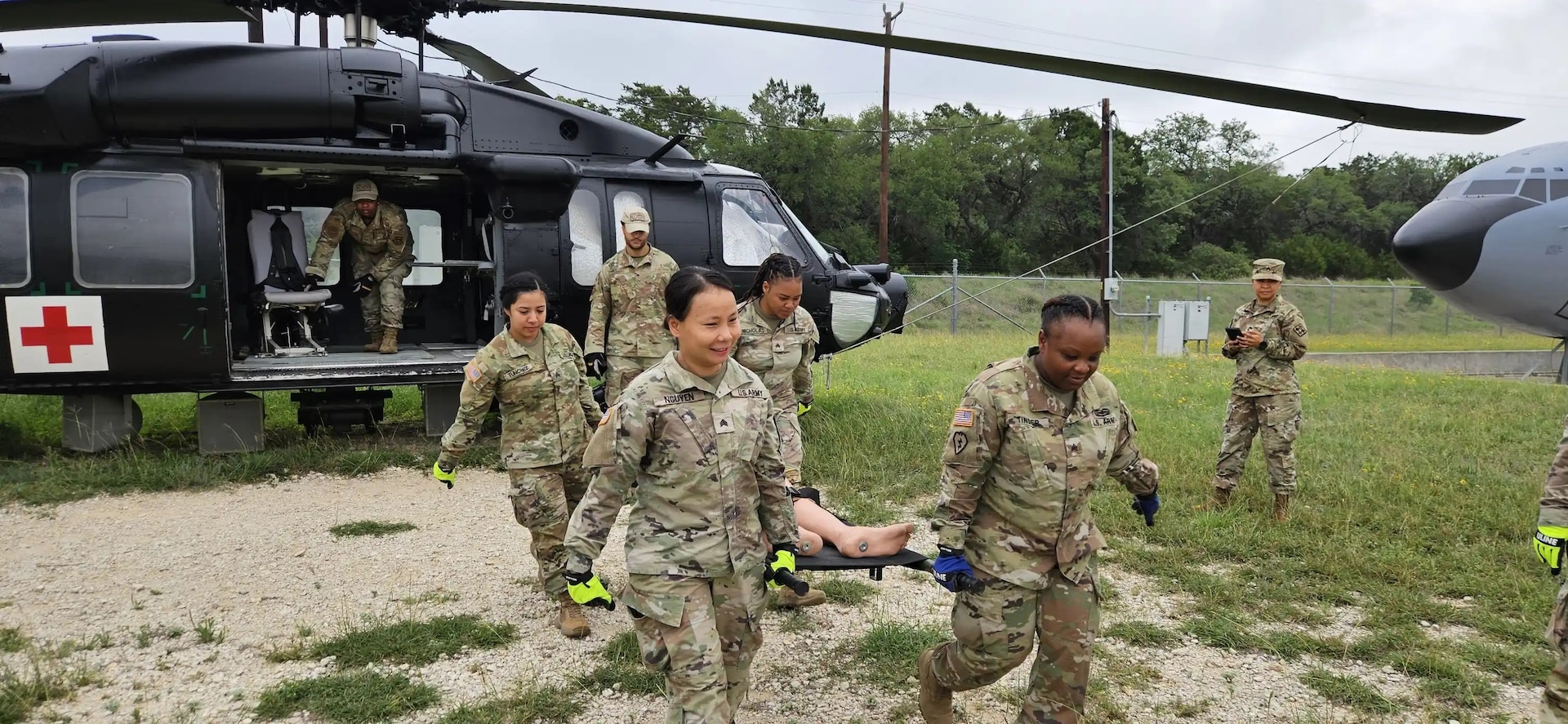 Army and Navy students in the Medical Education and Training Campus Respiratory Therapist course conduct a Joint Field Training Exercise on Joint Base San Antonio-Camp Bullis, Texas. A crucial component of the exercise involves Medical Evacuation and Aeromedical Evacuation procedures. Students practice the proper techniques for unloading a patient for transport to a military medical facility.