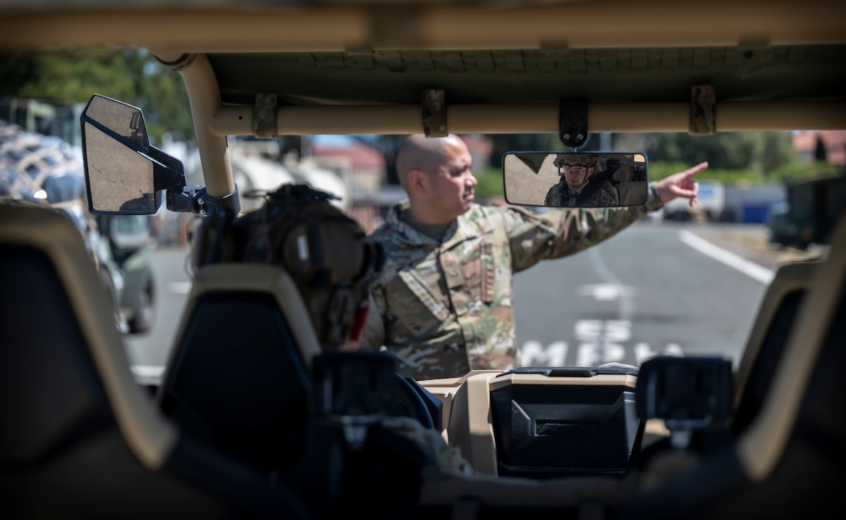 Airman directs another Airman