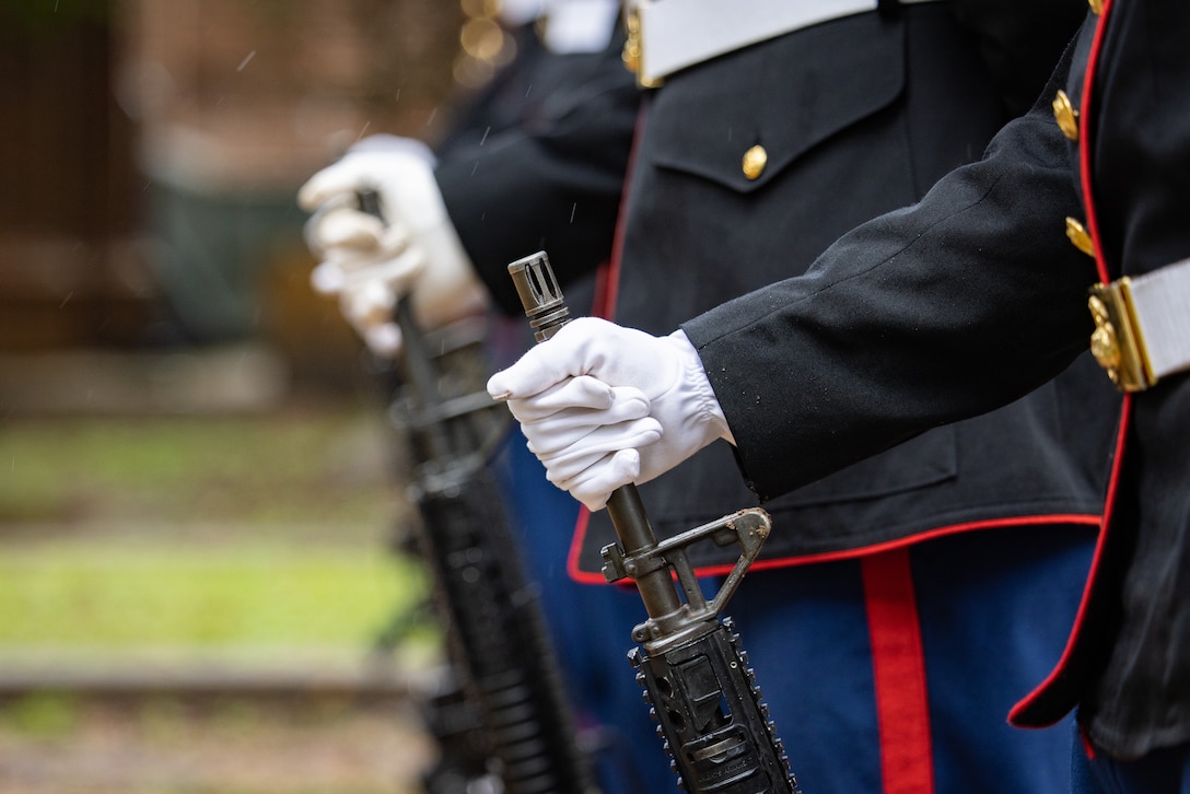U.S. Marines assigned to Truck Company, 23rd Marine Regiment, 4th Marine Division, hold the barrels of M16A4 rifles during a wreath laying ceremony for Gen. Robert Barrow, the 27th Commandant of the Marine Corps, in St. Francisville, L.A., Nov. 10, 2024. Barrow was the first Marine Corps commandant to be buried at his hometown and not in Arlington National Cemetery. Each year on the Marine Corps Birthday, Marines with Marine Forces Reserve lay a wreath on his grave. (U.S. Marine Corps photo by Sgt. Scott Jenkins)