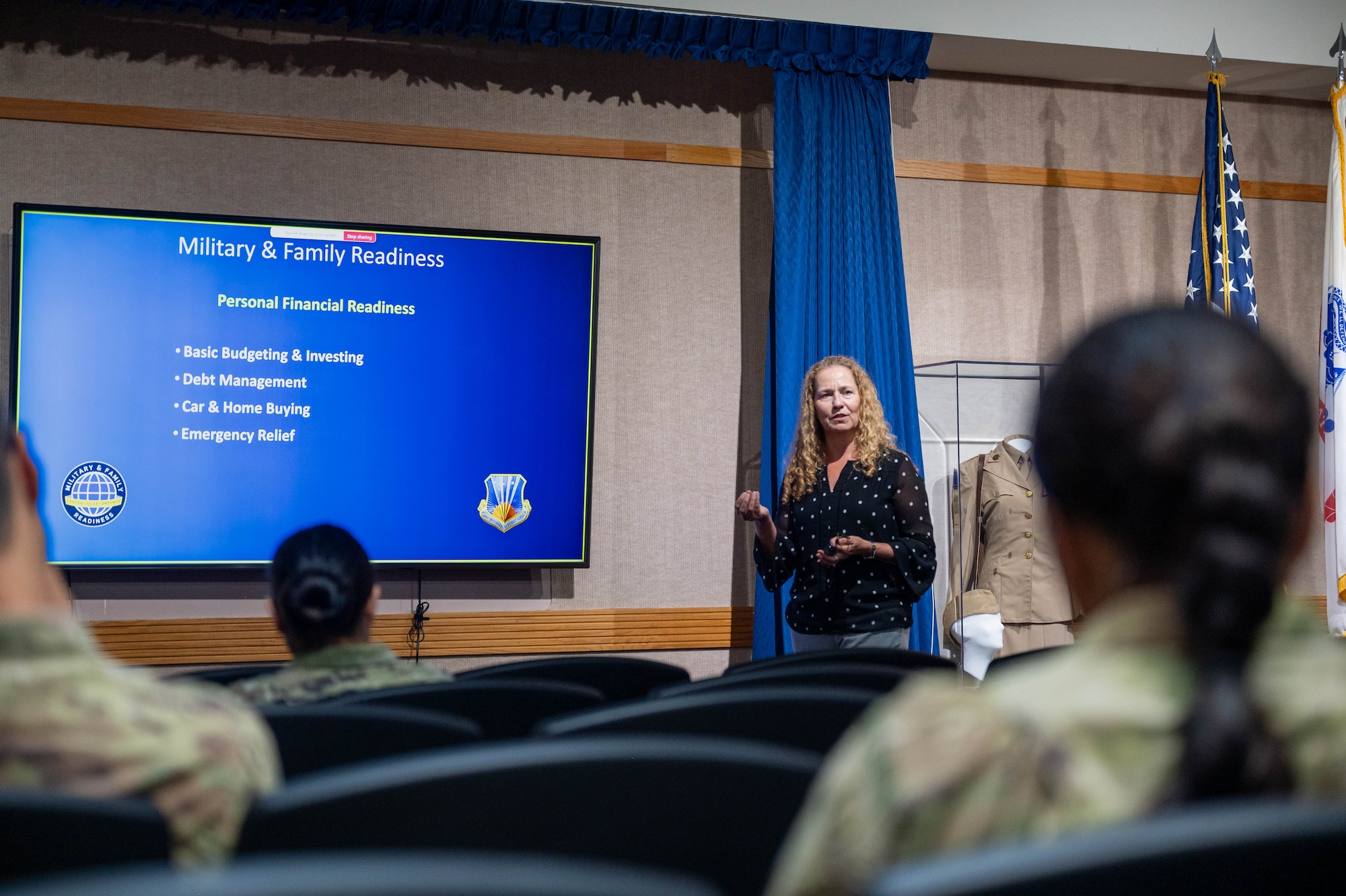 Ms. Patti Busque, 624th Force Support Flight Military & Family Readiness program manager, discusses the resources available to Citizen Airmen during onboarding for new military and civilian members by introducing the Pacific Warrior Orientation course on May 3, 2025, at Joint Base Pearl Harbor-Hickam.