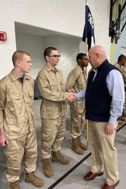Pfc. Scott Gabner, then a cadet at the Keystone State Challenge Academy, shakes hands with KSCA director Steve Grossman in January 2023. Gabner, who graduated from the KSCA in May 2023, is now a wheeled vehicle mechanic with Delta Co., 128th Brigade Support Battalion, 2nd Infantry Brigade Combat Team and works full-time as a mechanic at the Unit Training Equipment Site at Fort Indiantown Gap. (Courtesy photo)