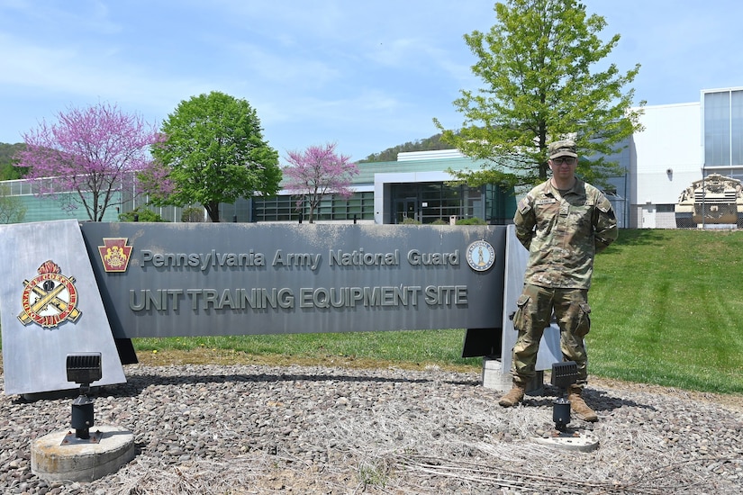 Pfc. Scott Gabner poses for a photogram outside the Unit Training Equipment Site at Fort Indiantown Gap, Pa., on April 29, 2025. Gabner, a graduate of the Keystone State Challenge Academy, is a wheeled vehicle mechanic with Delta Co., 128th Brigade Support Battalion, 2nd Infantry Brigade Combat Team and works full-time as a mechanic at UTES. (Pennsylvania National Guard photo by Brad Rhen)