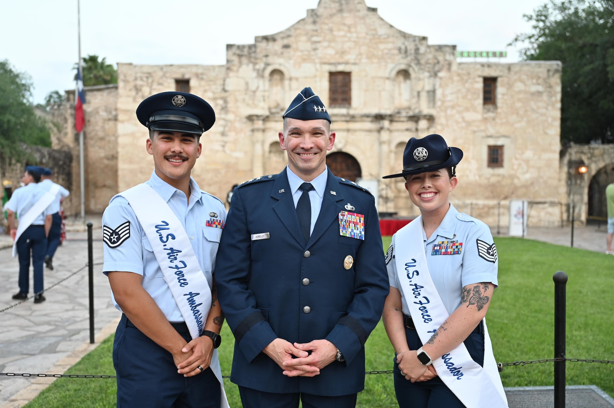 Air Force leadership and ambassadors stand in front of the Alamo.