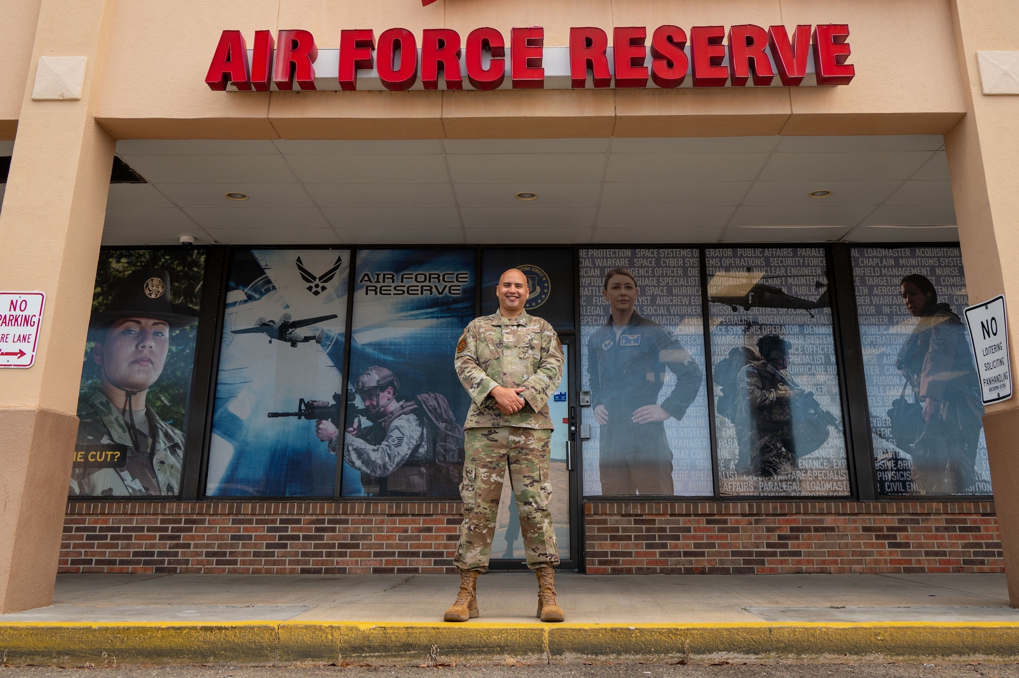 Master Sgt. Michael Arriaga, 919th Special Operations Wing, recruiter, poses for a photo in front of the Air Force Reserve Recruiting Office in Mary Ester, FL. There are over 200 career opportunities within the Air Force Reserve.