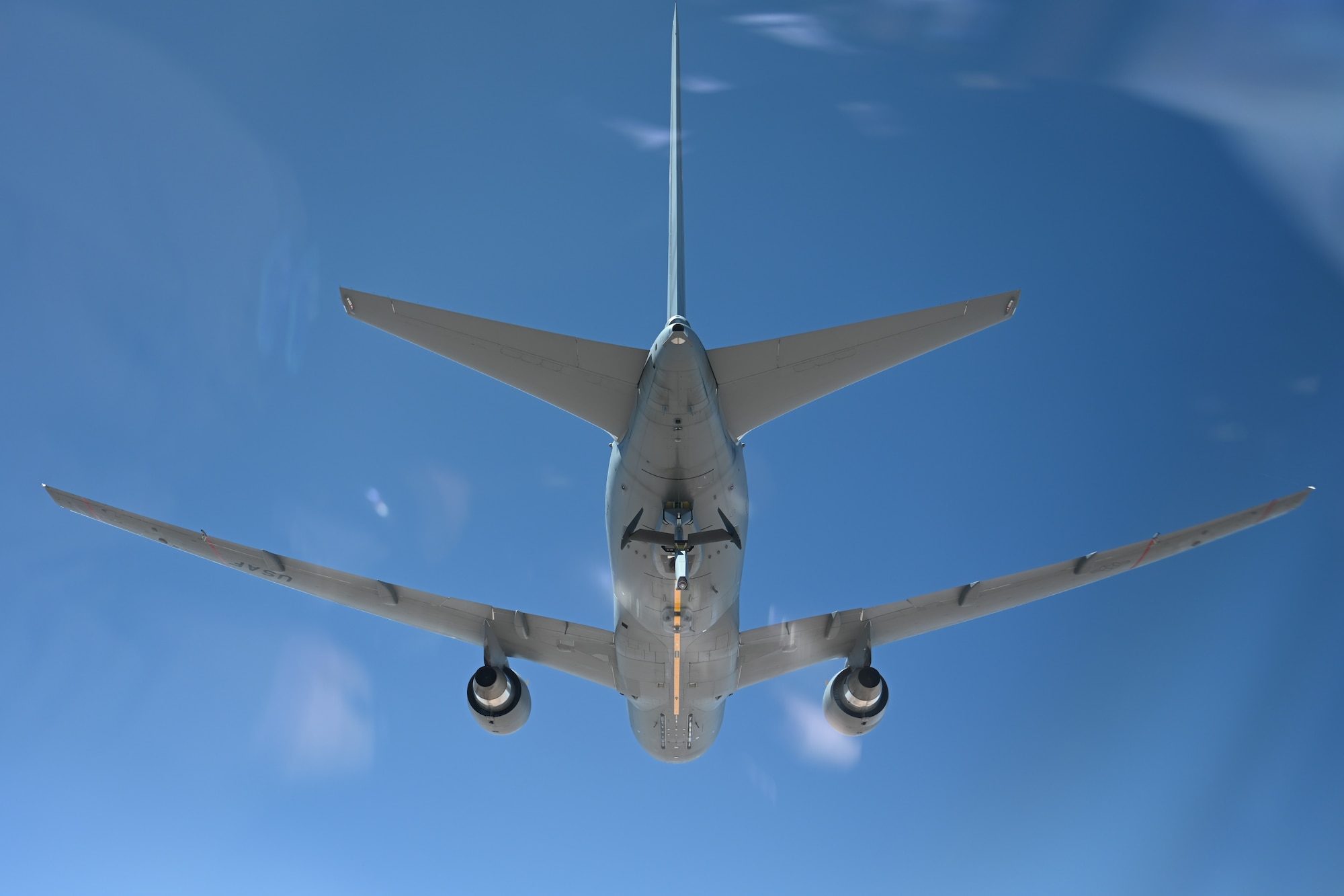 A U.S. Air Force KC-46 Pegasus aircraft assigned to the 56th Air Refueling Squadron prepares to refuel an aircraft, in the Oklahoma skies, April 30, 2025. The KC-46 is equipped with a refueling boom to refuel most fixed-wing, receiver-capable aircraft. (U.S. Air Force photo by Airman 1st Class Nathan Langston)