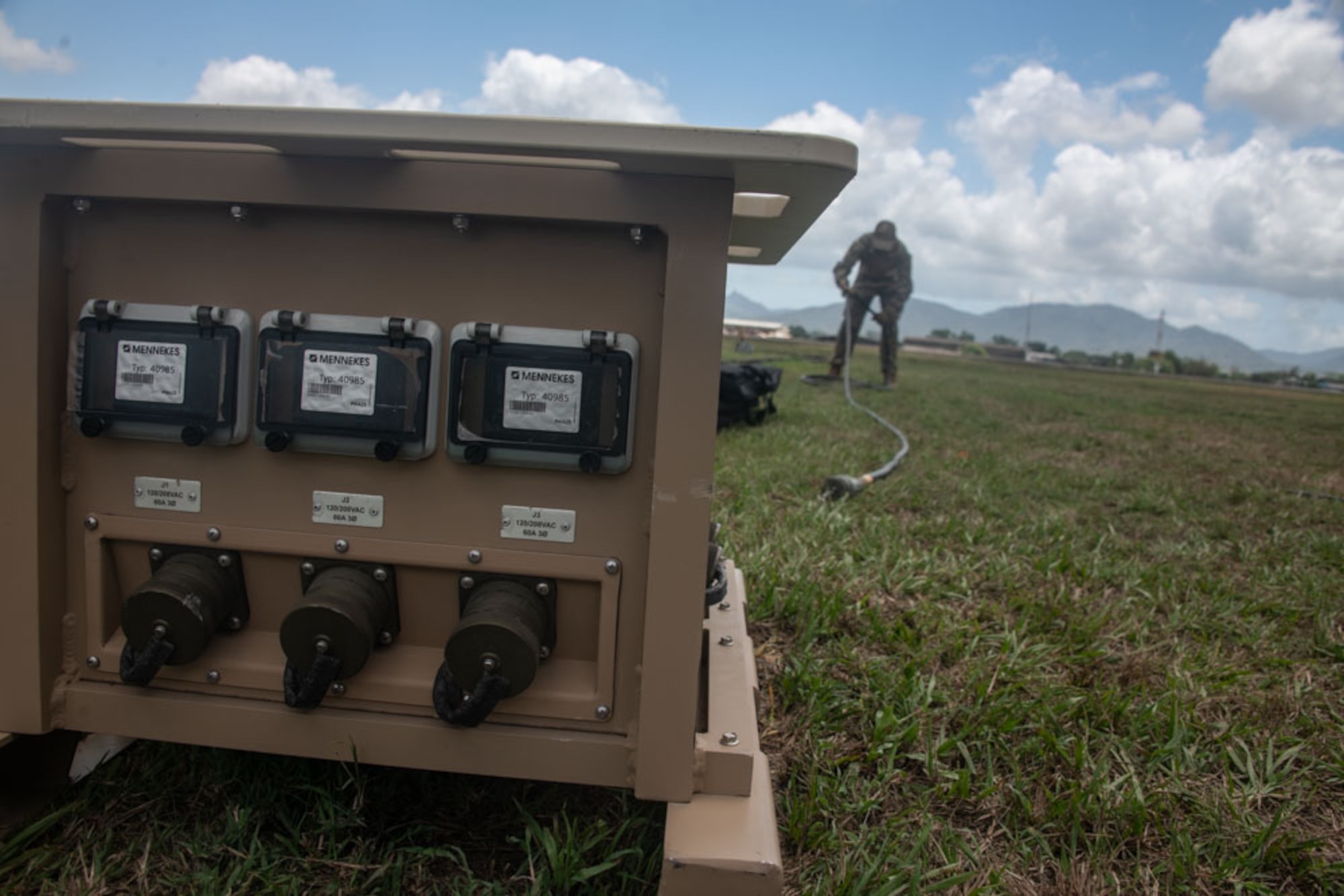 An Airman gathers a cable
