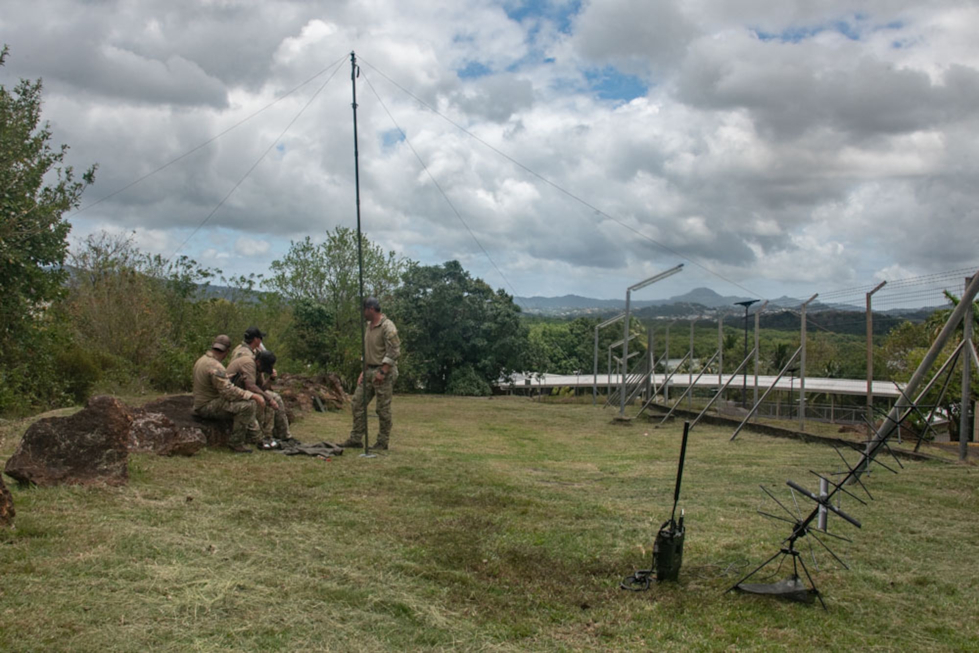 Four Airmen set up a radio satellite
