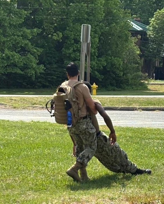 Hospital Corpsman Third Class (HM3) Kevin Ayala Calderon moves a sailor to safety for injury assessment during a Tactical Combat Casualty Care (TCCC) Course at Navy Medicine Readiness and Training Command (NMRTC) Patuxent River. TCCC is a pre-hospital trauma care system specifically designed for the tactical environment.  The program emphasized rapid assessment and treatment of life-threatening injuries under stress, while minimizing the risk to the rescuer. NMRTC Patuxent River offers the TCCC course monthly, ensuring sailors maintain their qualifications.