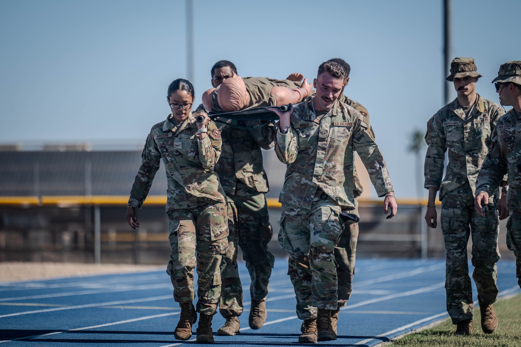 U.S. Air Force Airmen assigned to the 56th Security Forces Squadron move a simulated casualty during the 2025 Police Week Defender Challenge, May 13, 2025, at Luke Air Force Base, Arizona.