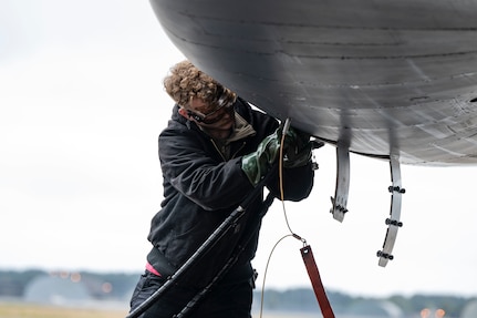 A B-1 bomber sits on the flightline in the rain