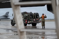 An airman performs maintenance on a B-1 bomber aircraft