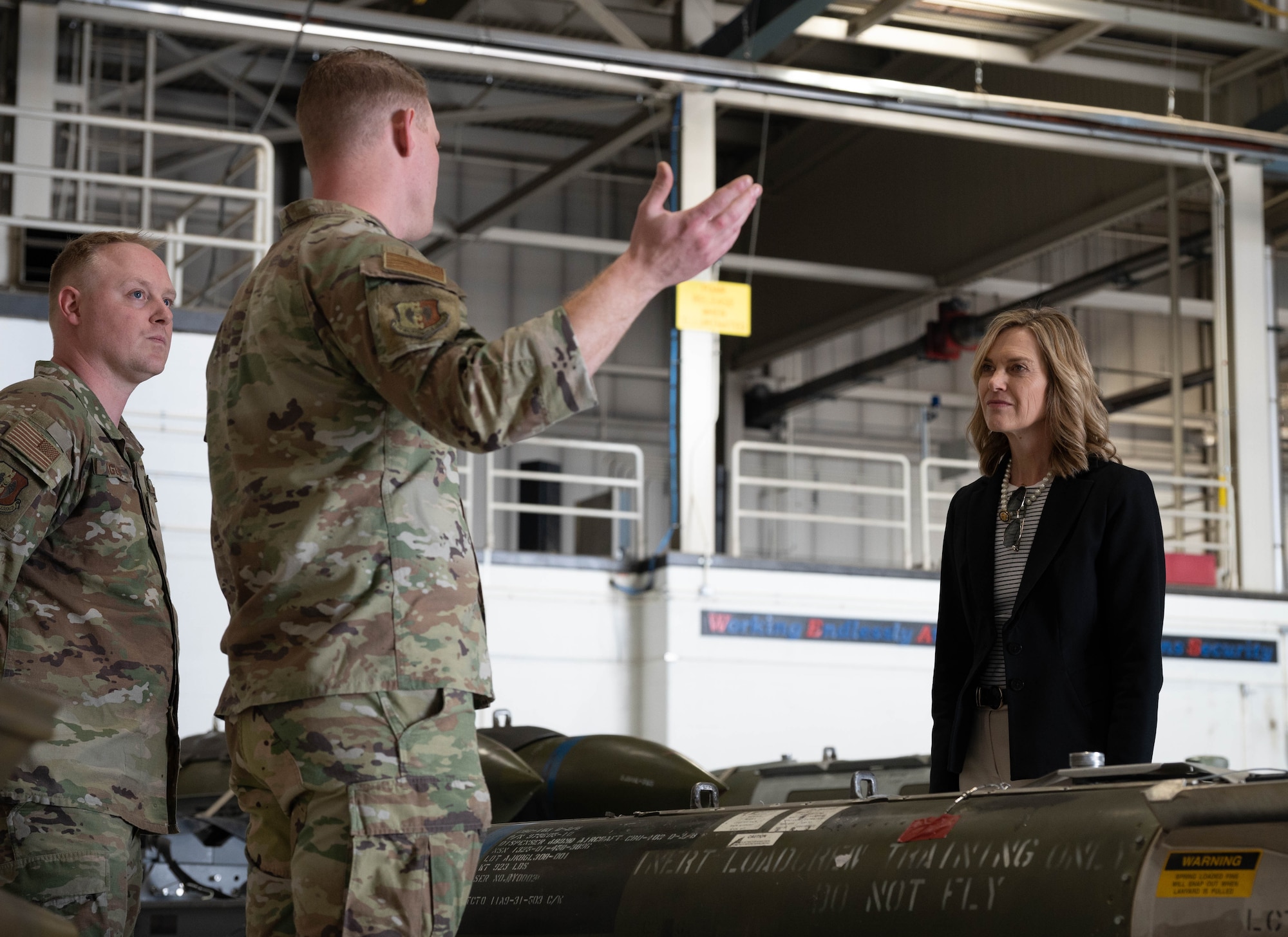Tech. Sgt. Andrew Sigler (left) and Tech. Sgt. Kirby Keith (right), loading standardization crew members, show Rep. Julie Fedorchak static displays of inert conventional munitions used by the B-52H Stratofortress at Minot Air Force Base, North Dakota, May 5, 2025. The B-52H Stratofortress uses many different munitions to accomplish a variety of missions. (U.S. Air Force photo by Airman 1st Class Wesley Davies)