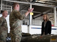 Tech. Sgt. Andrew Sigler (left) and Tech. Sgt. Kirby Keith (right), loading standardization crew members, show Rep. Julie Fedorchak static displays of inert conventional munitions used by the B-52H Stratofortress at Minot Air Force Base, North Dakota, May 5, 2025. The B-52H Stratofortress uses many different munitions to accomplish a variety of missions. (U.S. Air Force photo by Airman 1st Class Wesley Davies)
