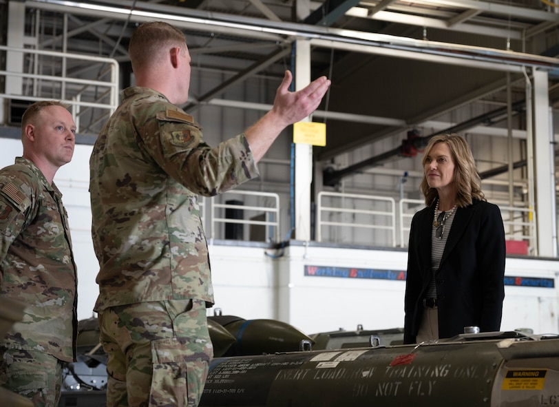 Tech. Sgt. Andrew Sigler (left) and Tech. Sgt. Kirby Keith (right), loading standardization crew members, show Rep. Julie Fedorchak static displays of inert conventional munitions used by the B-52H Stratofortress at Minot Air Force Base, North Dakota, May 5, 2025. The B-52H Stratofortress uses many different munitions to accomplish a variety of missions. (U.S. Air Force photo by Airman 1st Class Wesley Davies)