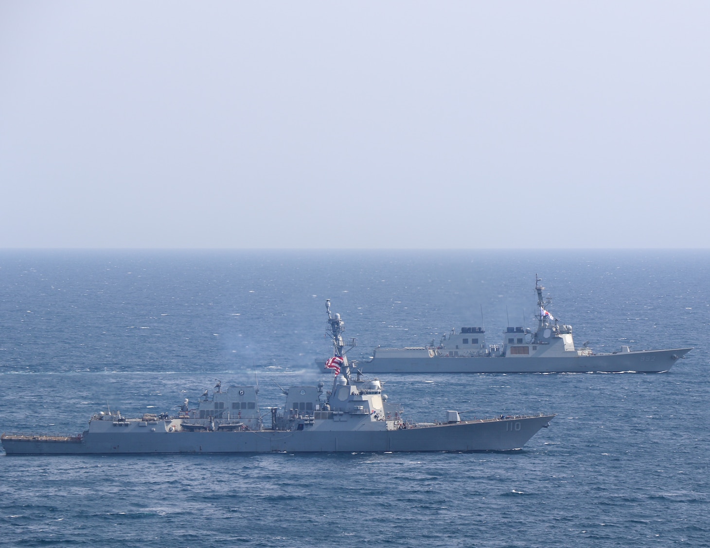 AT SEA (May, 8, 2025) - The Arleigh Burke-class guided-missile destroyer USS William P. Lawrence (DDG 110), left, and the Sejong the Great-class destroyer ROKS Yulgok Yi-I (DDG-992), right, sail together during Maritime Counter Special Operations Exercise (MCSOFEX) May, 8, 2025. MCSOFEX is a high-profile exercise focused on readiness and shaping the maritime domain to achieve both U.S. and the Republic of Korea cooperation objectives. William P. Lawrence is deployed and assigned to Destroyer Squadron (DESRON) 15, the Navy’s largest DESRON and the U.S. 7th Fleet’s principal surface force. (U.S. Navy photo by Naval Aircrewman Tactical Helicopter 3rd Class Seth Evans)