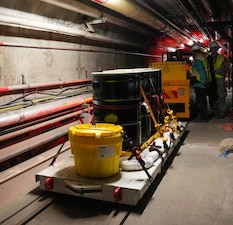 A contractor with Navy Closure Task Force-Red Hill (NCTF-RH) operates a material transport train during a movement demonstration at the Red Hill Bulk Fuel Storage Facility (RHBFSF) in Honolulu, May 2, 2025. The train will move sections of removed pipes during the safe and deliberate decommissioning of the RHBFSF. Charged with the safe decommissioning of the facility, NCTF-RH was established by the Department of the Navy as a commitment to the community and the environment. NCTF-RH continues to engage with the people of Hawaii, regulatory agencies, and other stakeholders as it safely and deliberately decommissions the RHBFSF. (U.S. Navy photo by Mass Communication Specialist 1st Class Glenn Slaughter)