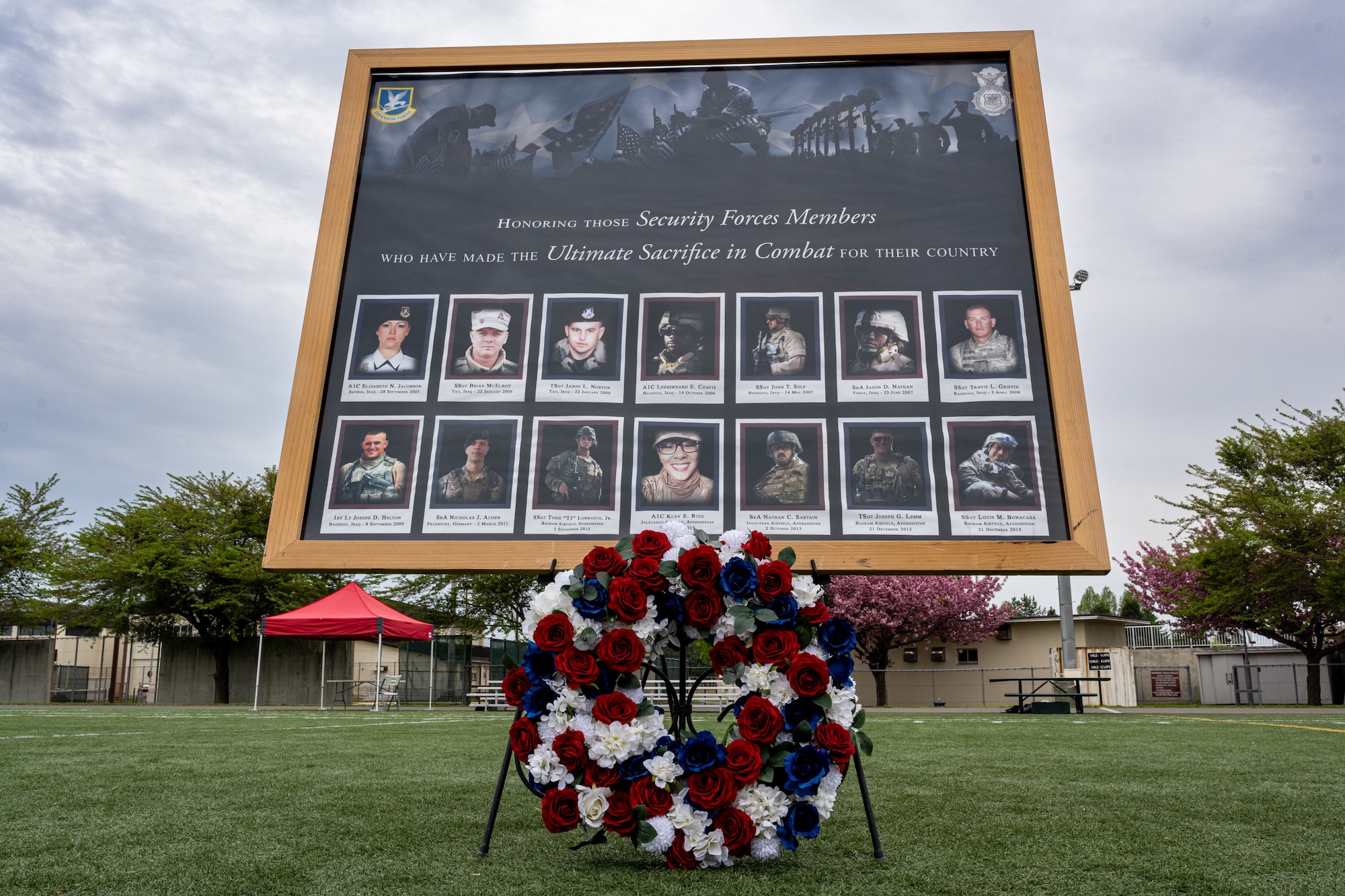 A wreath in front of a memorial