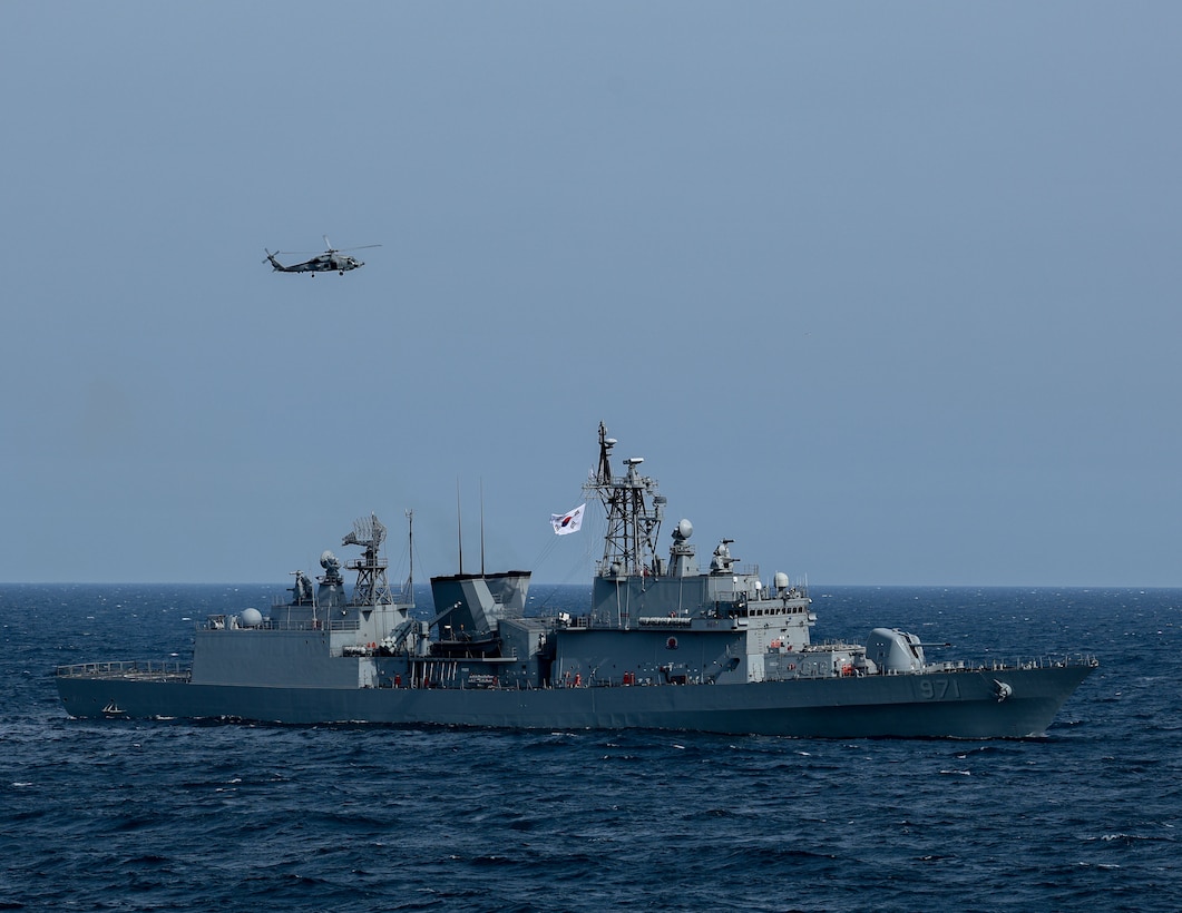 AT SEA (May, 8, 2025) - The first-in-class destroyer ROKS Gwangaeto the Great (DDH 971) and MH-60R Seahawk assigned to the "Blue Hawks" of Helicopter Maritime Strike Squadron (HSM) 78 operate together during Maritime Counter Special Operations Exercise (MCSOFEX) May, 8, 2025. MCSOFEX is a high-profile exercise focused on readiness and shaping the maritime domain to achieve both U.S. and the Republic of Korea cooperation objectives. William P. Lawrence is deployed and assigned to Destroyer Squadron (DESRON) 15, the Navy’s largest DESRON and the U.S. 7th Fleet’s principal surface force. (U.S. Navy photo by Mass Communication Specialist 3rd Class Gavin Arnoldhendershot)