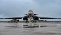 An airman performs maintenance on a B-1 bomber aircraft